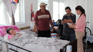 journalists interviewing people in a hospital after Huracan Maria