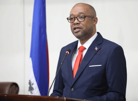 Dr. Bertrand Sinal, Minister of Public Health and Population, talks during a public event.