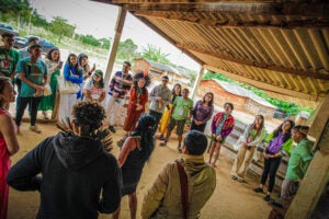 Group of people standing in a circle