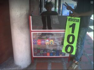 A man selling cellphone airtime on the street