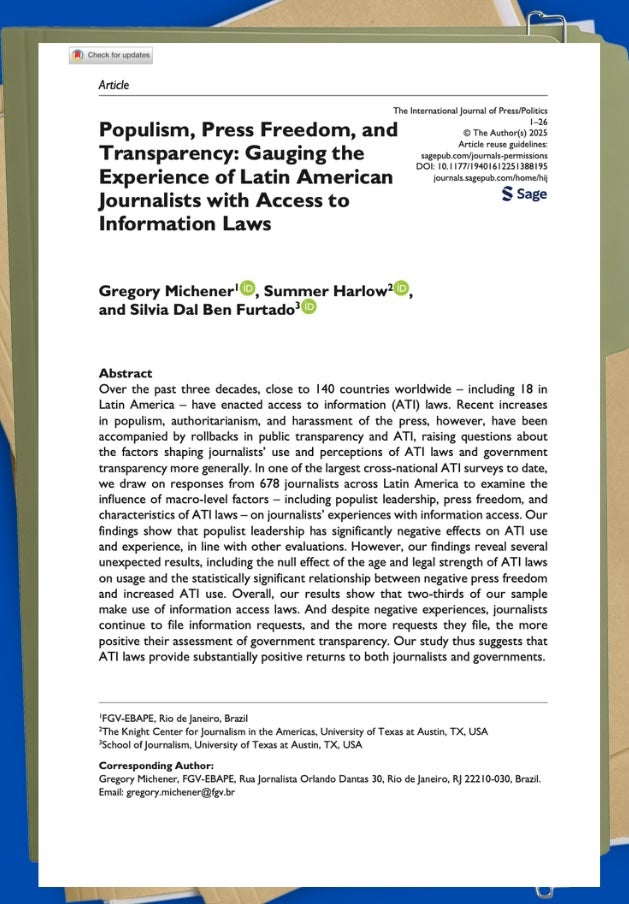 Cover of an academic journal article displayed on top of stacked file folders.