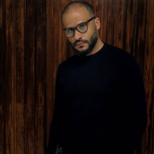 Man in a black sweater looking at the camera