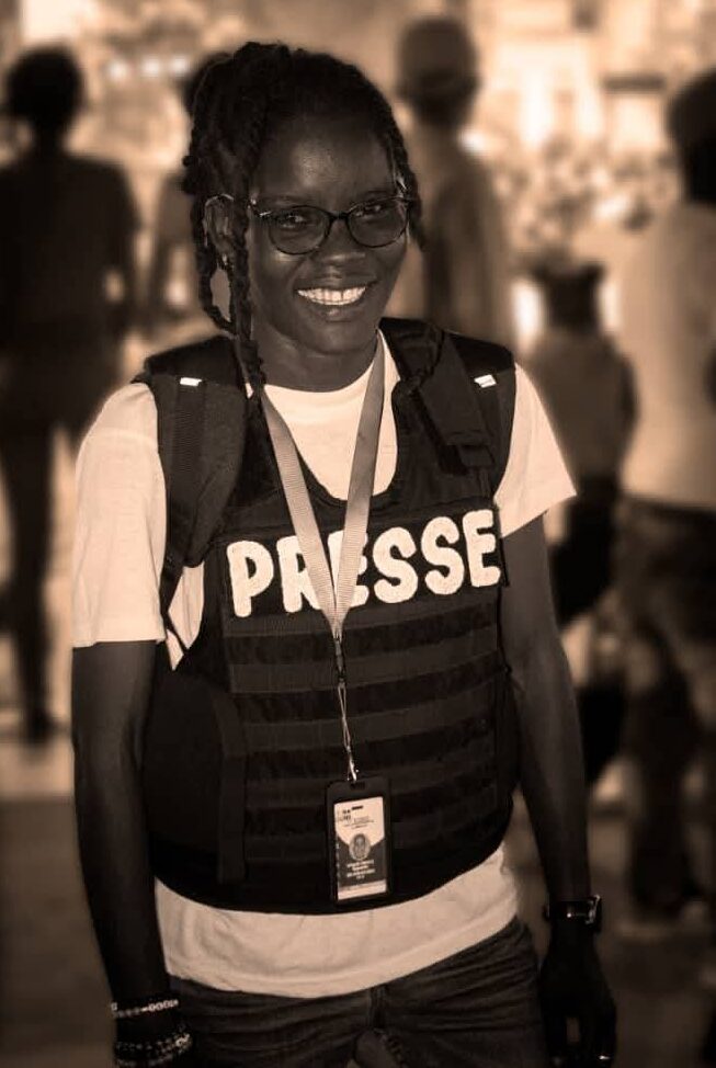 Haitian journalist Velondie Miracle poses during a reporting assignment.